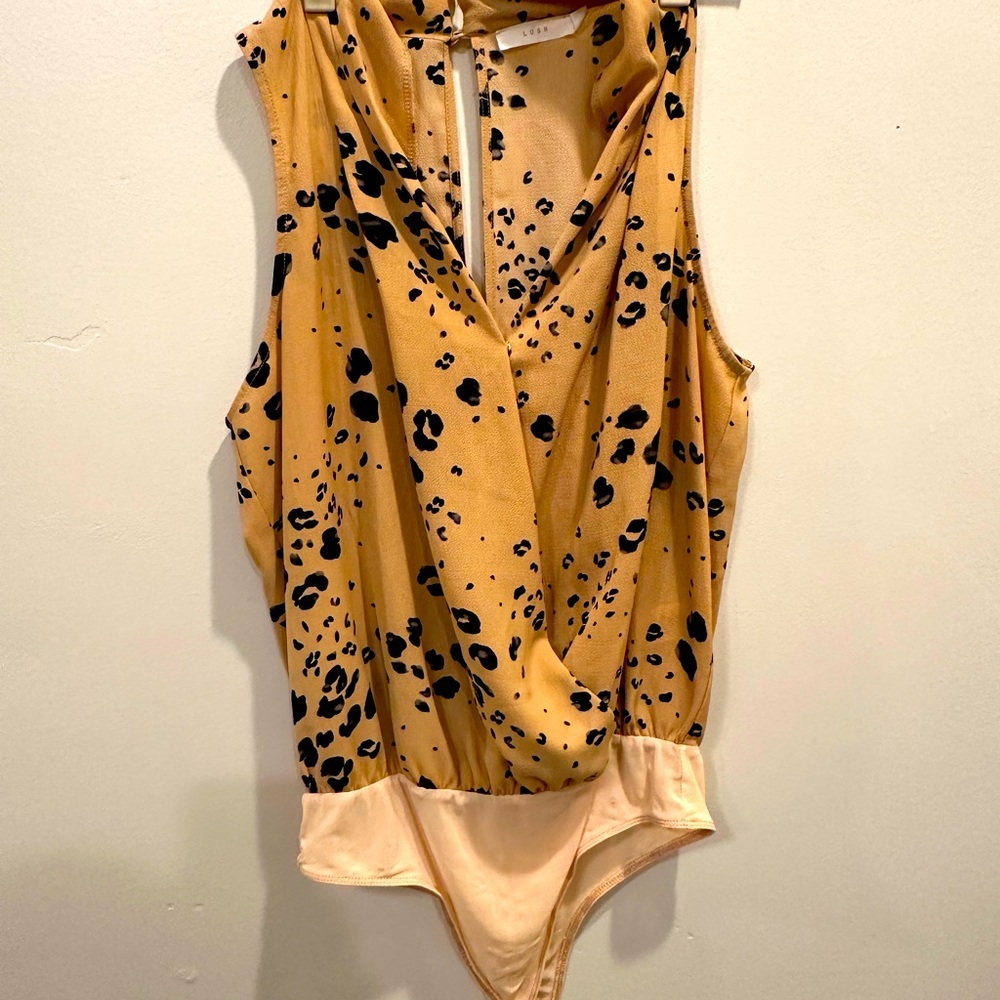 Lush. Animal print body suit. Tan and Blake color.
